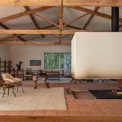 A Monumental Hearth Anchors This Agricultural Building Turned Home in Brazil